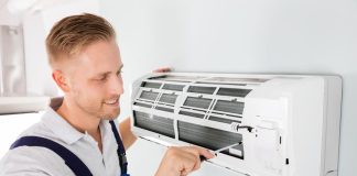 man doing air conditioner service