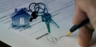 A person signing a pirchase contract finding something appropriate in accordance with the North Carolina real estate trends.