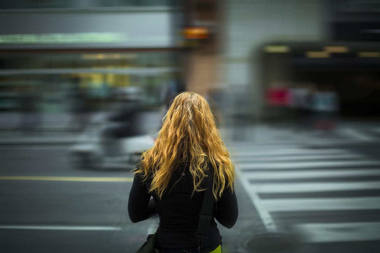 A woman crossing the street.