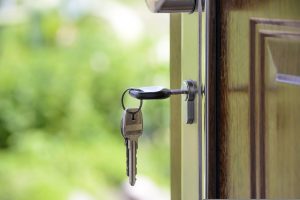 SOme keys in the lock of an open door as favorable real estate options are one of the reasons to move to Kendall, FL.